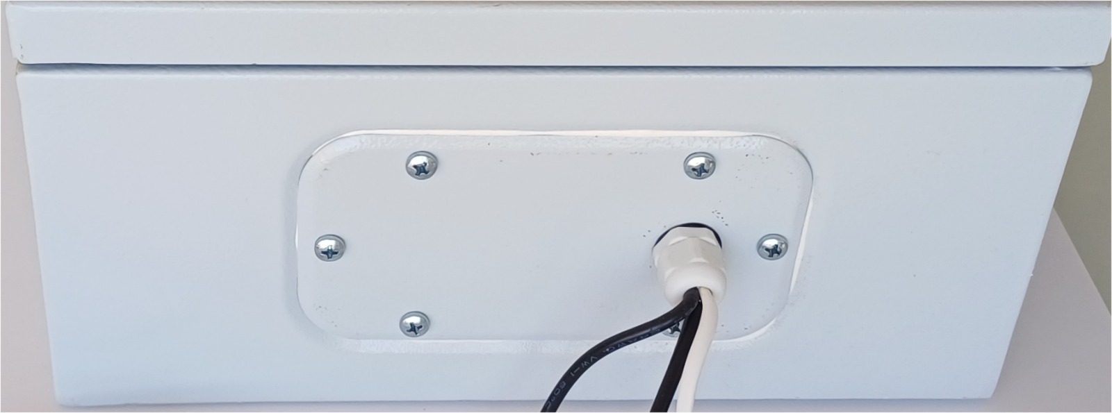 Cables passing through the sealed enclosure cable gland